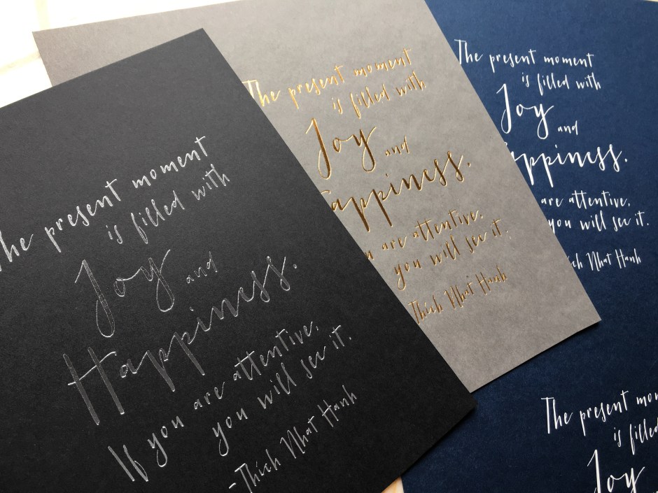 Silver Foil, Gold Foil, and White foil stamped on colored paper stocks.