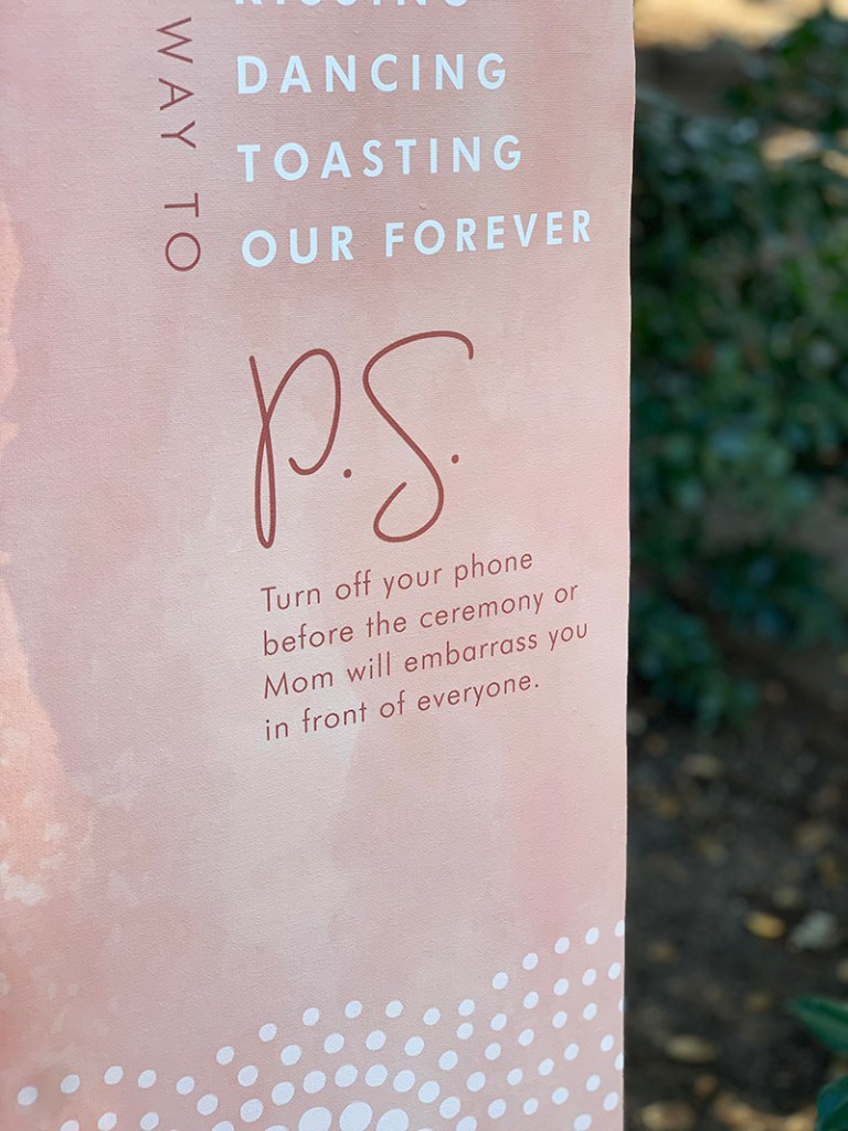 Vertical banner with ribbon and dowel for hanging. Custom printed on canvas.