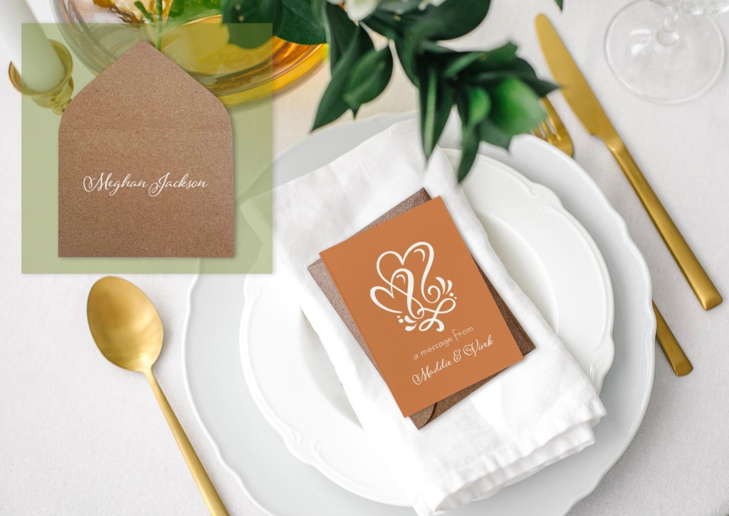 Custom printed mini note cards used as place cards at a wedding table with white ink calligraphy on the kraft envelopes.